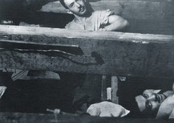 Kalman Linkimer (top) and Zelig Hirschberg in the hiding place, Libau, 1944.