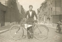 Bernard Aufrychter with a bicycle with the flag of the Zionist Betar party attached to it, Charleroi, 1938.