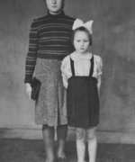 Stefania Podgórska (left) wearing a skirt given to her in gratitude by one of the Jewish women she hid, with her sister Helena, Przemyśl, 1943.