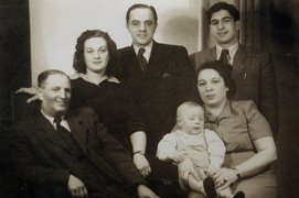 Left to right: Karol Fleischer, Elizabet Uher, Martin Uher, the Uhers’ son on Regina Fleischerová’s lap, Mordechai Fleischer, Bratislava, 1950s.