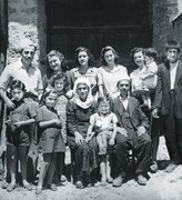 Front row from left: Gavra and Irena Mandil, Deshira, Fatima, Esad, and Vesel Veseli. Back row: Moshe and Gabriela Mandil, Finiza and Ruzhica Ben-Josef, Hyrije Veseli with her child Lule, and an employee, Kruja, June 1944.