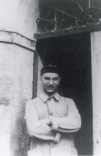 Father Arrigo Beccari outside the Rubbiara di Nonantola church, 1940s.