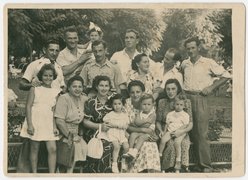 Tuvia Bielski with his daughter (back row, 2nd and 3rd from left), his wife Leah and his son (front row, 5th and 6th from left), his brother Zus (back row, 4th from right), his cousin Yehuda (back row, far right), and other surviving members of the Bielski group, Israel, 1948.