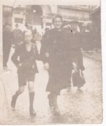 Charles Aufrychter with his mother Perla on Rue de la Montagne in the center of Charleroi, May 1942.