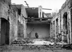 Carl Lutz in the ruins of the former British embassy, Budapest, 1945.
