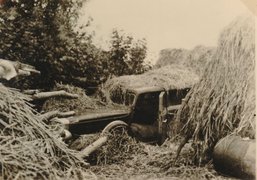 An old car used as a hiding place on the farm, as photographed by the German regular police, October 1943.